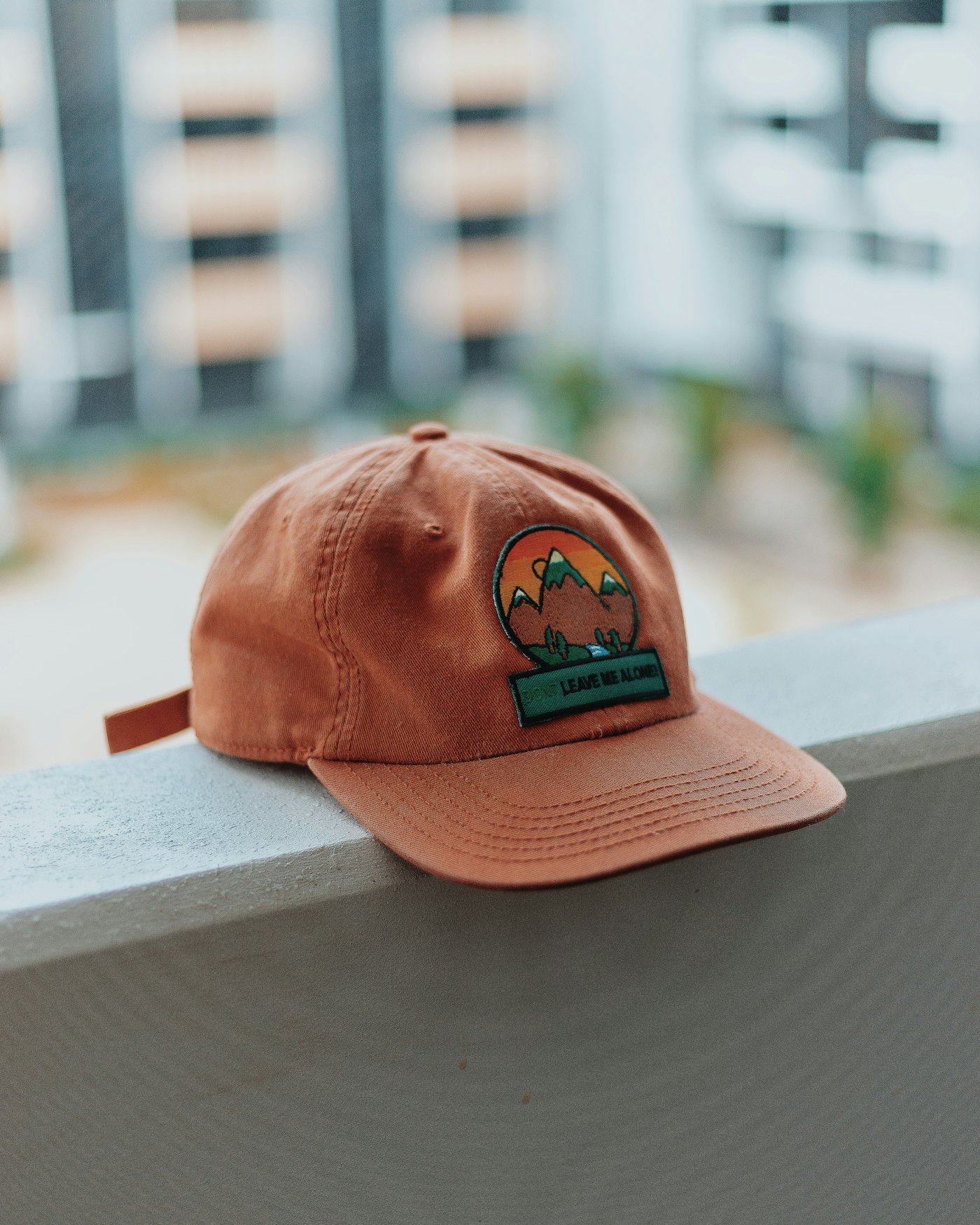 Cap with a dimensional embroidered mountain patch