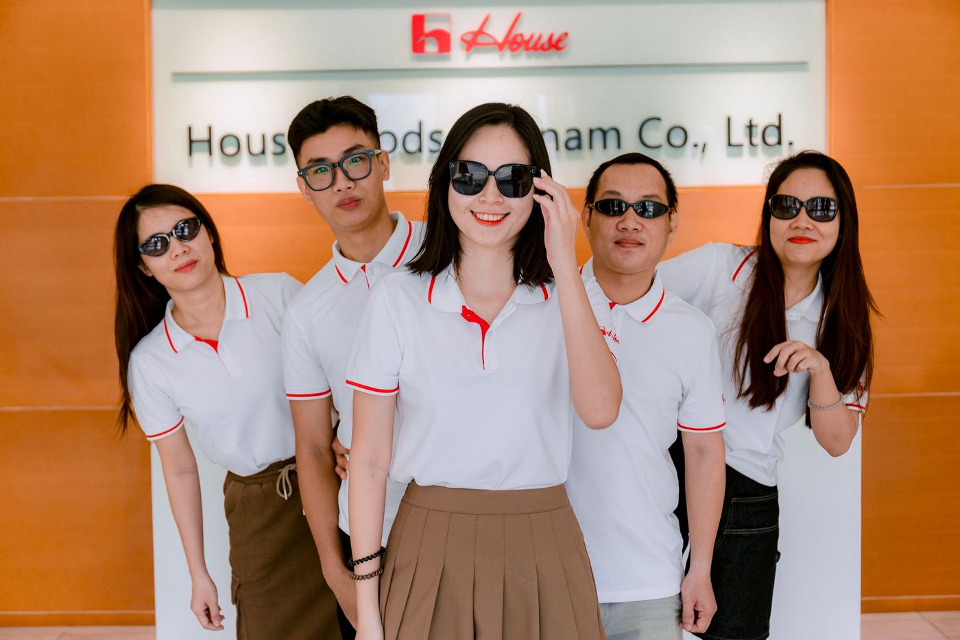 Company staff wearing coordinated polo shirts