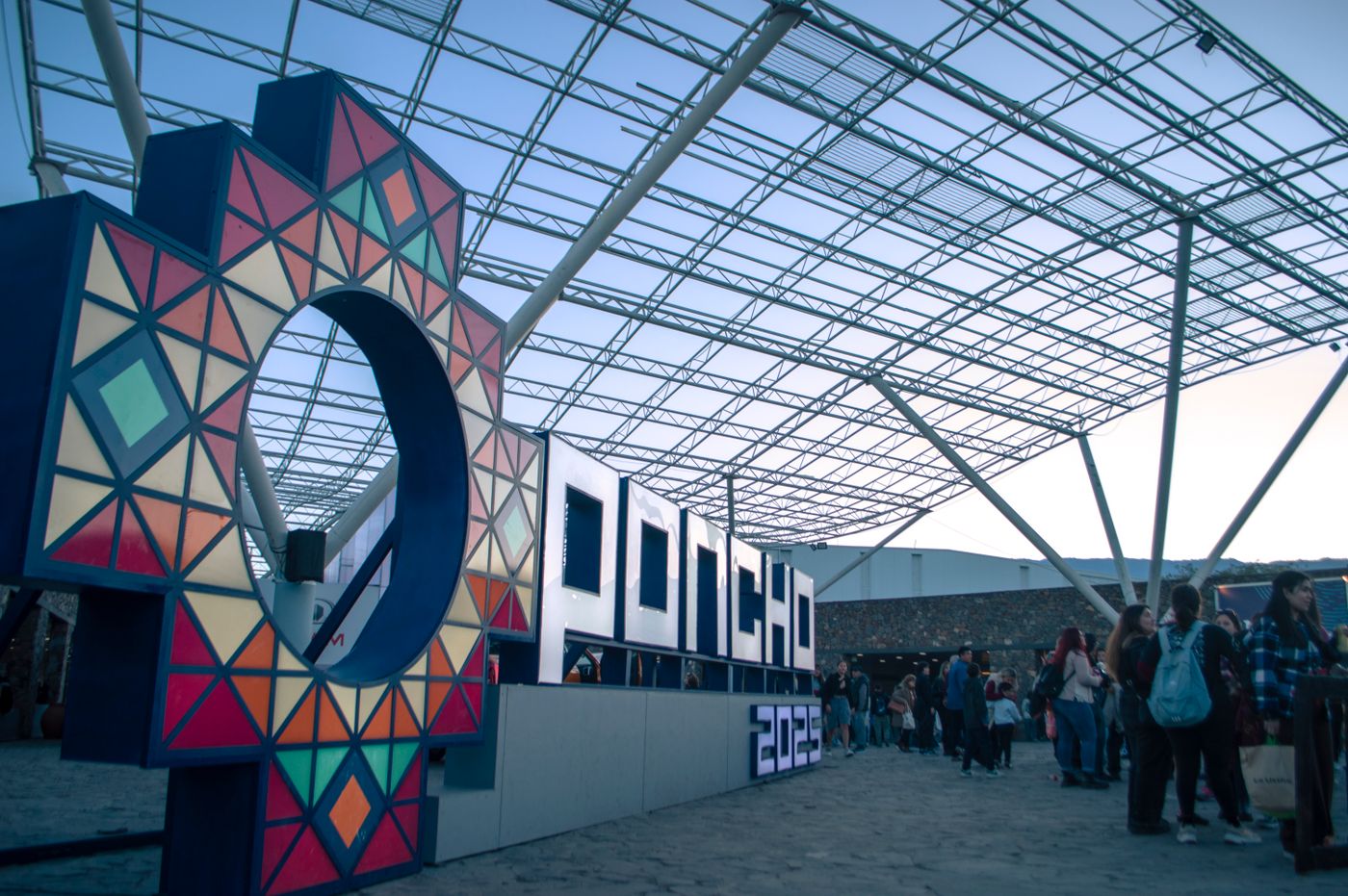 Large colorful event signage at a public exhibition