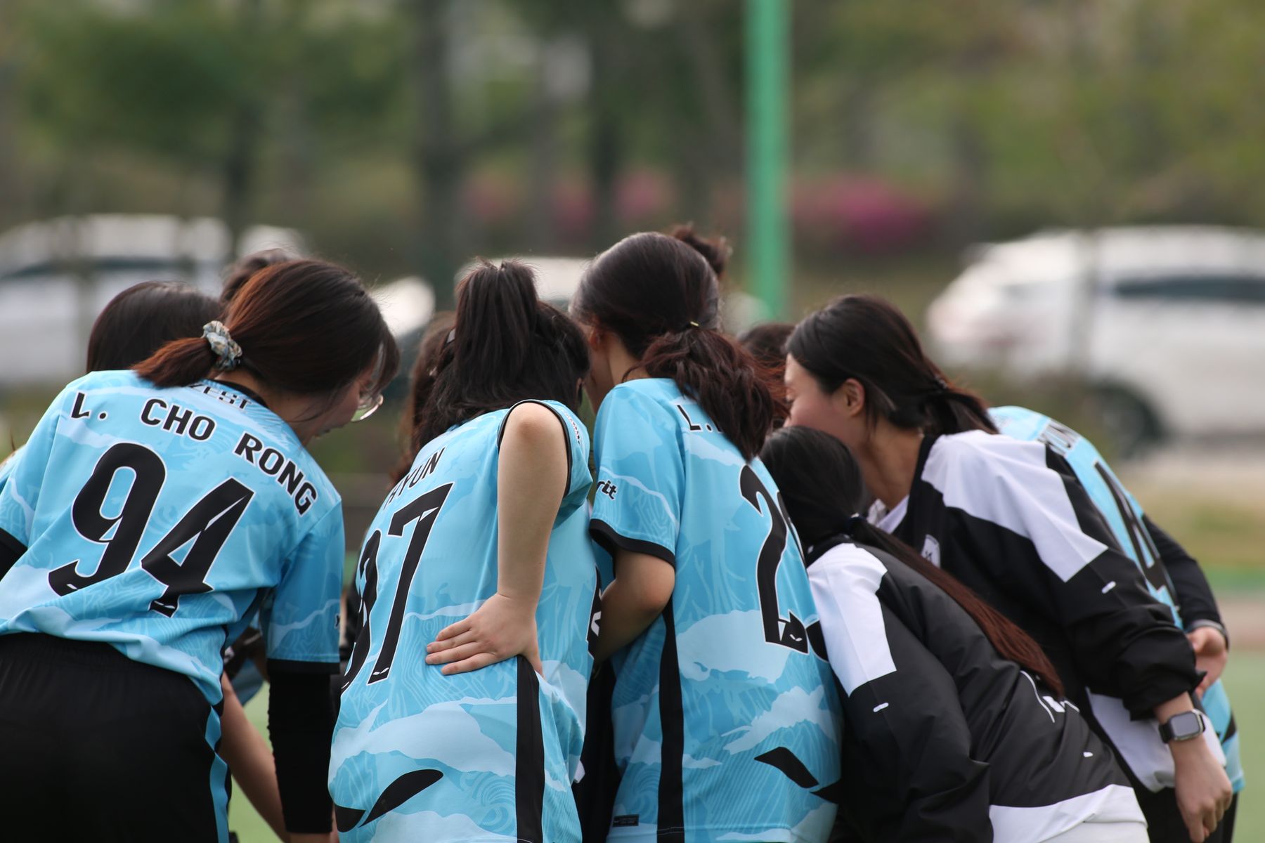 Women's sports team in coordinated jerseys before a match
