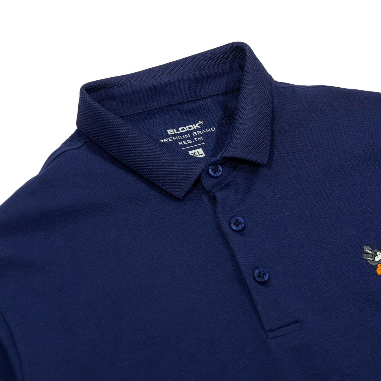 Navy polo with a small embroidered chest motif