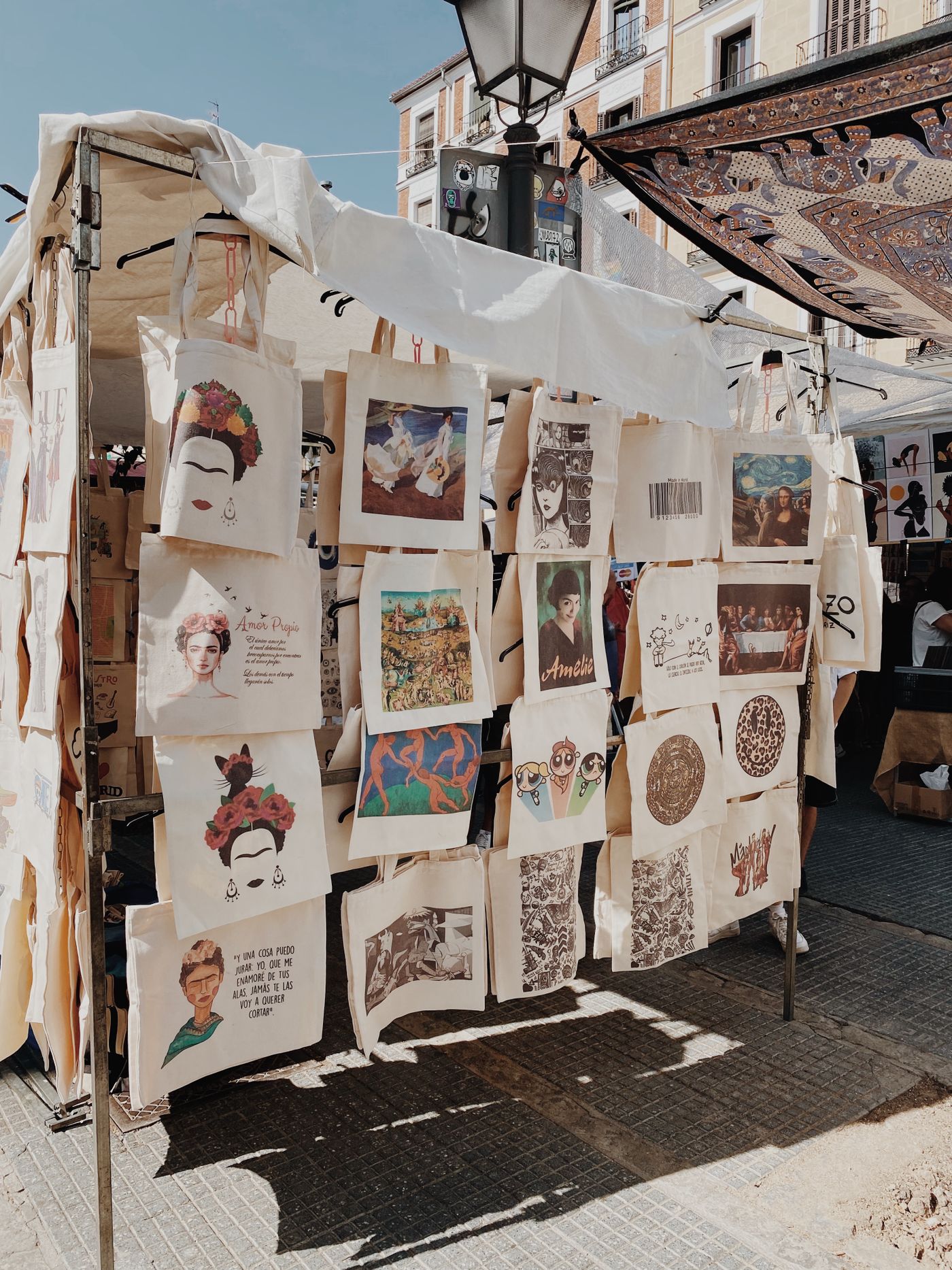 Printed canvas tote bags displayed at an event