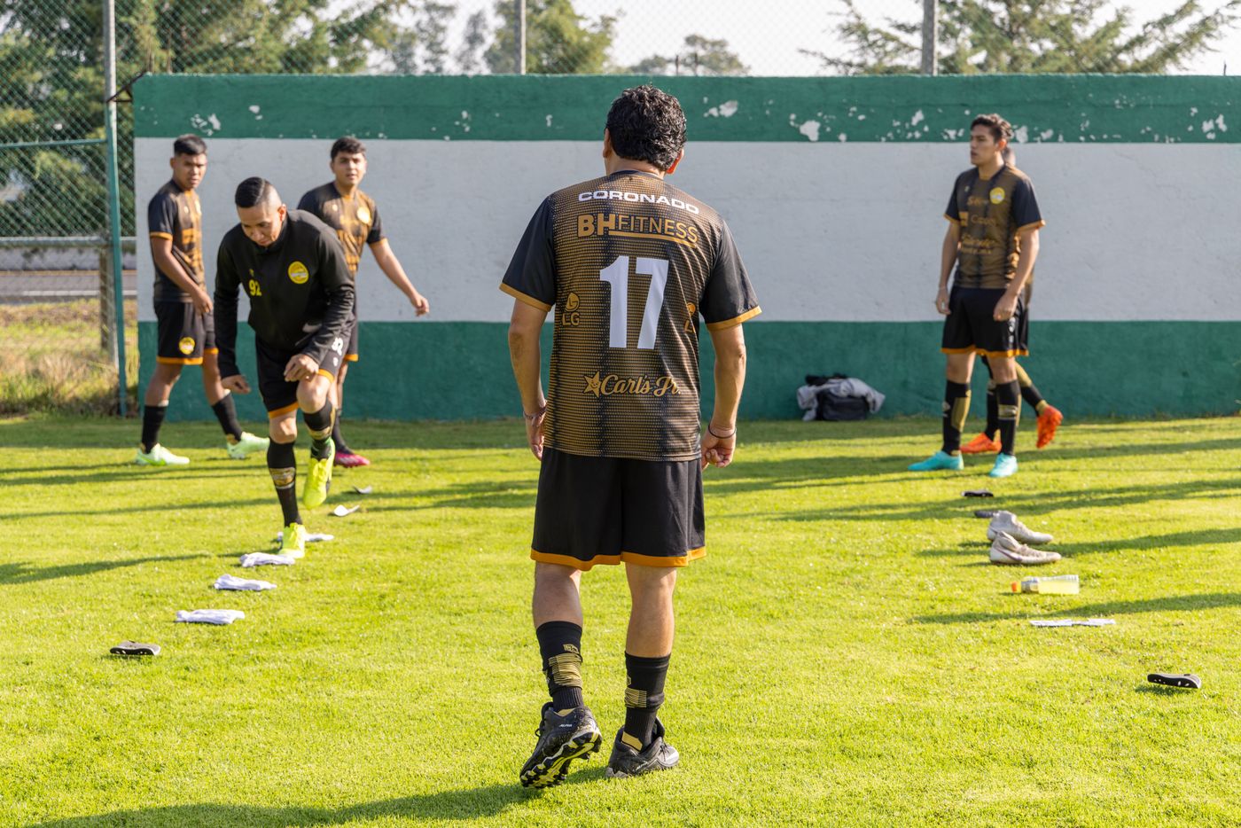 Soccer team warming up in coordinated training uniforms